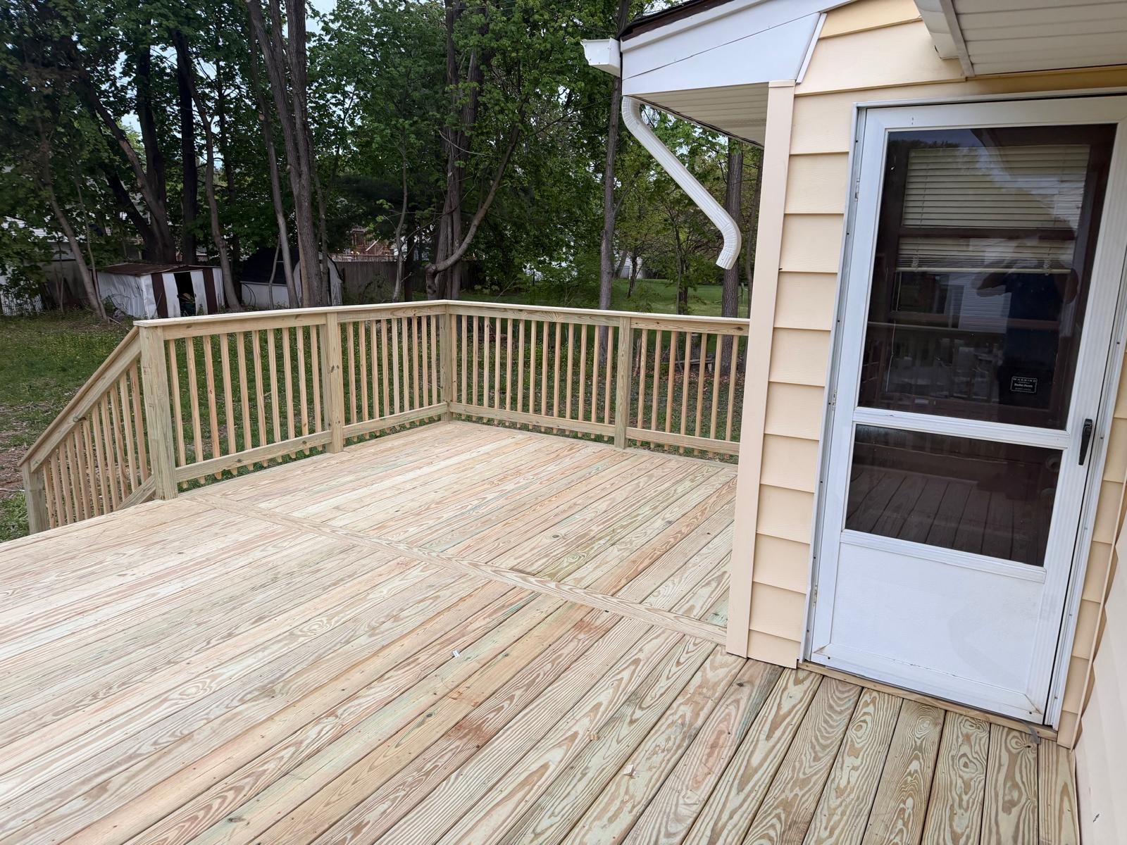 Newly built pressure-treated wood deck