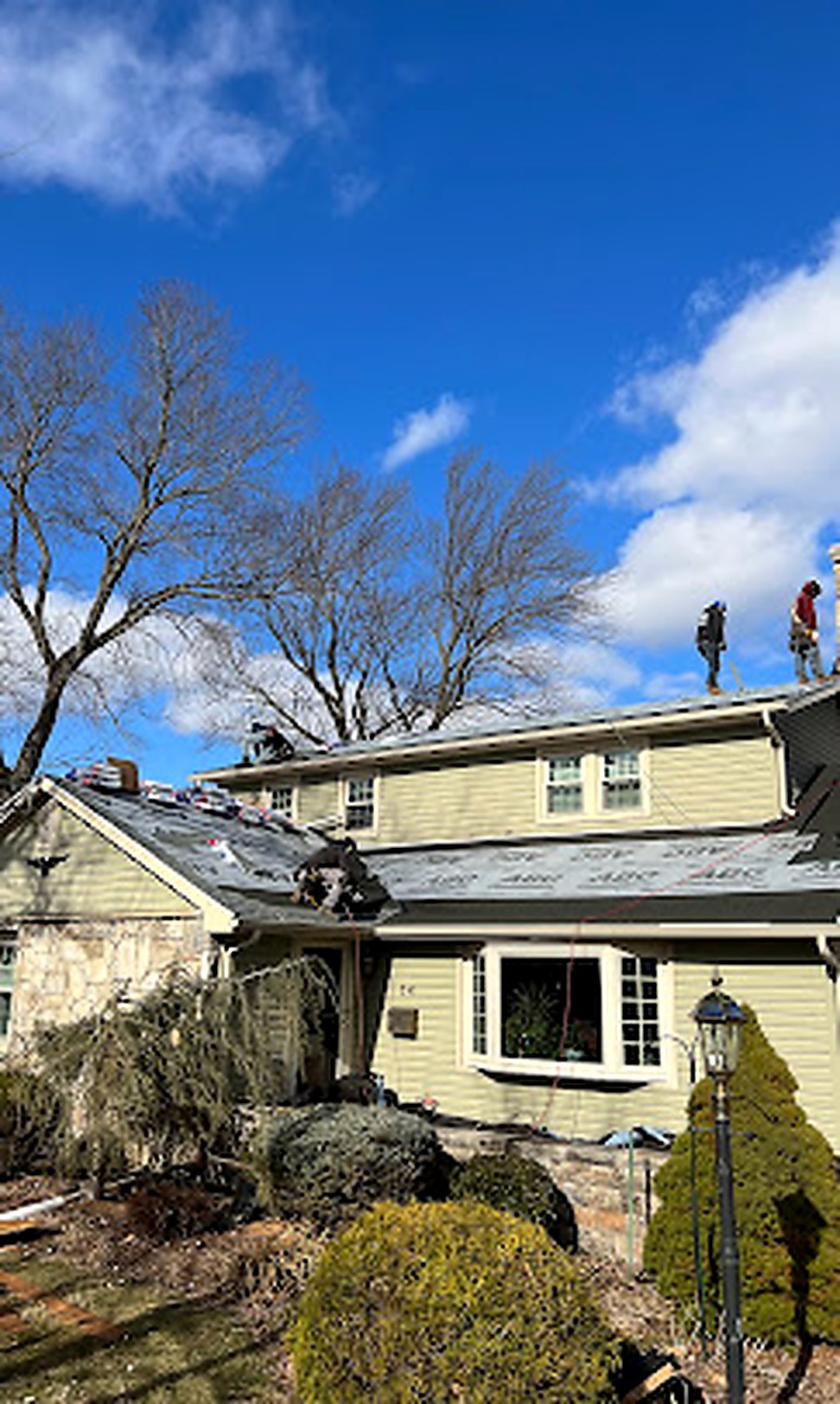 1 All American Roofing crew inspecting a residential roof