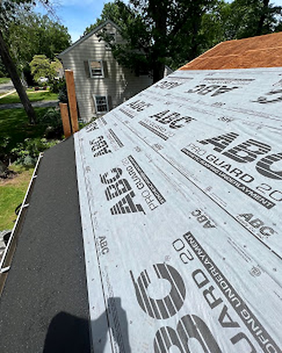 New roof installation with underlayment going down