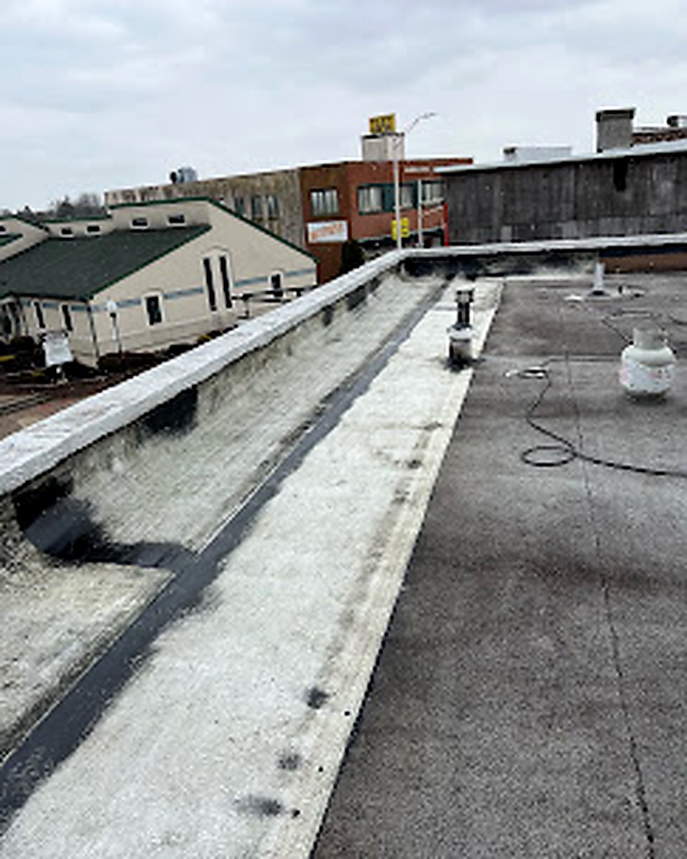 Commercial flat roof with new silver coating